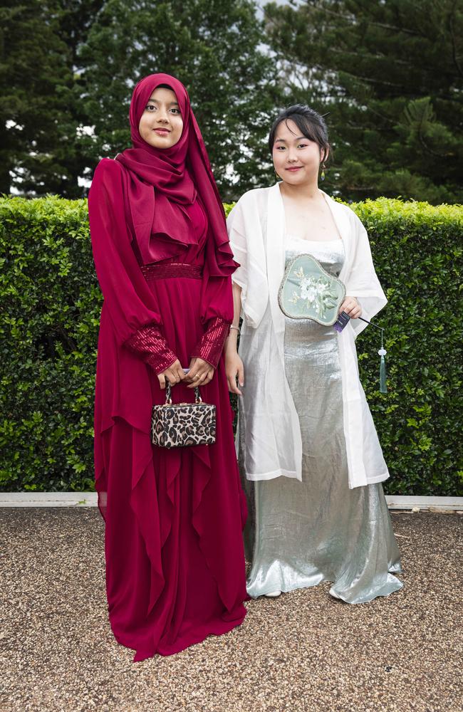 Duti Raisa (left) and Wenquig Jiang at Centenary Heights State High School formal at Picnic Point, Friday, November 15, 2024. Picture: Kevin Farmer