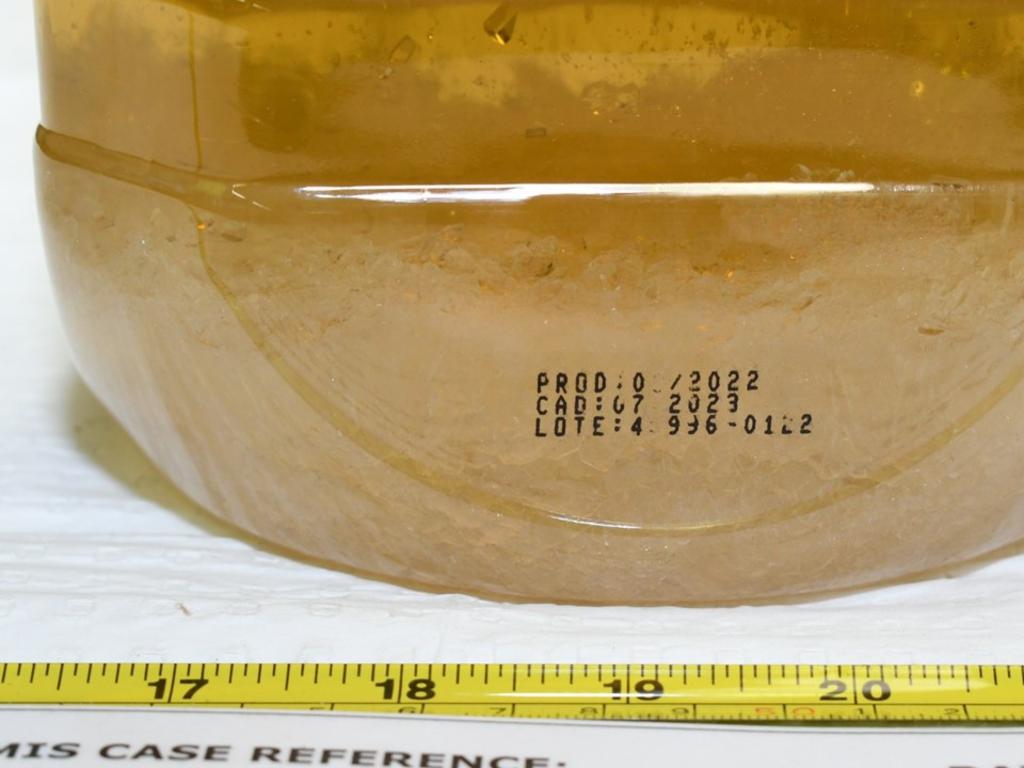 Ice settling at the bottom of a bottle of seized olive oil. Picture: Australian Federal Police