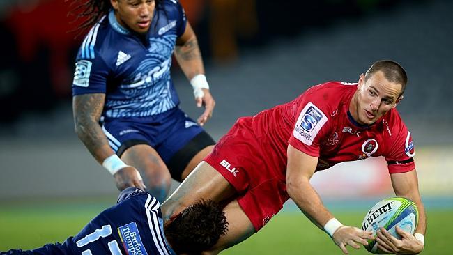 Mike Harris is tackled by Jackson Willison as Ma’a Nonu looms up to try and pilfer the ball.