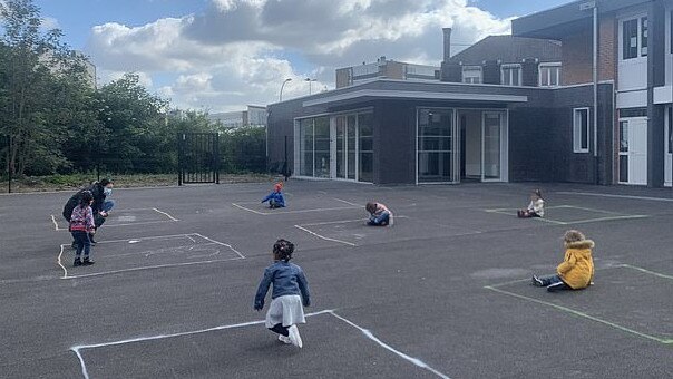 Children in the town of Tourcoing are forced to play by themselves metres apart.