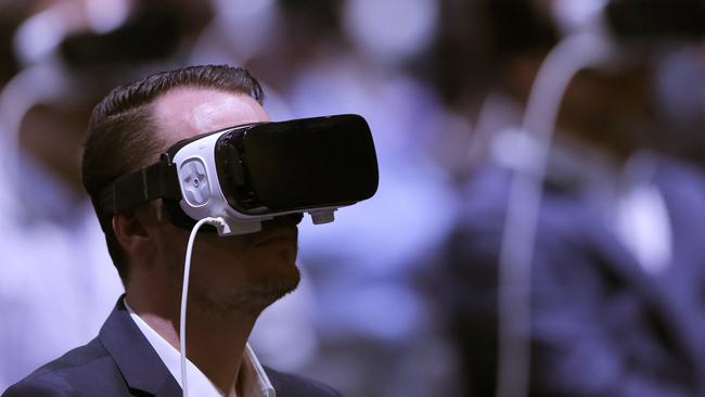 Attendees use the new Samsung Gear 360, a 360-degree camera, during the Samsung Galaxy Unpacked 2016 event on the eve of this week’s Mobile World Congress wireless show, in Barcelona, Spain, Sunday, Feb. 21, 2016. (AP Photo/Manu Fernadez)