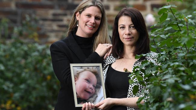 Adelaide MP Kate Ellis with Anna Pak Poy with a photo of baby Sebby, who was diagnosed with a rare, terminal illness at seven months. Picture: Tom Huntley