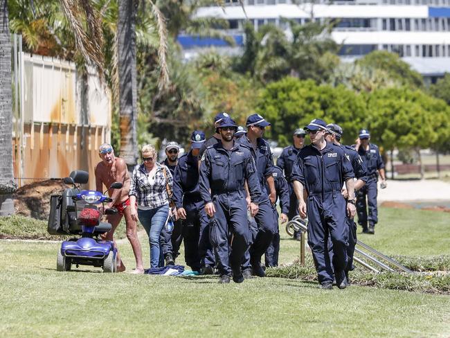 NSW Police Public Order and Riot Squad members search the banks of the Tweed River, Monday, November 26, 2018. Police are searching for evidence in relation to the death of a nine-month-old baby who washed up on Surfers Paradise beach last week. (AAP Image/Tim Marsden)