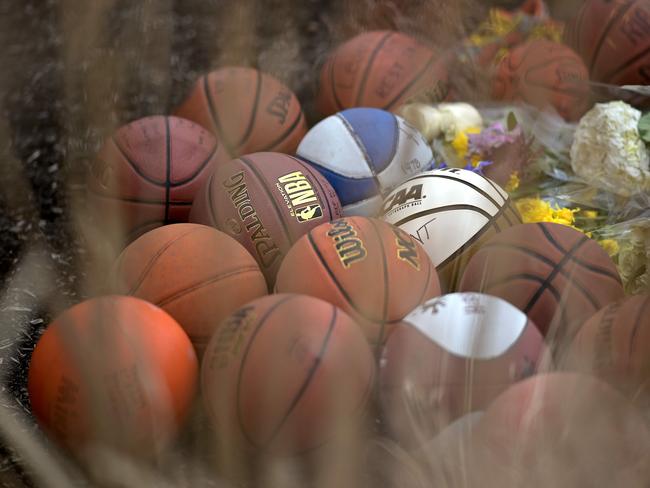 Basketballs are left outside Bryant Gymnasium at Lower Merion High School, where Kobe Bryant formally attended school. Picture: AFP