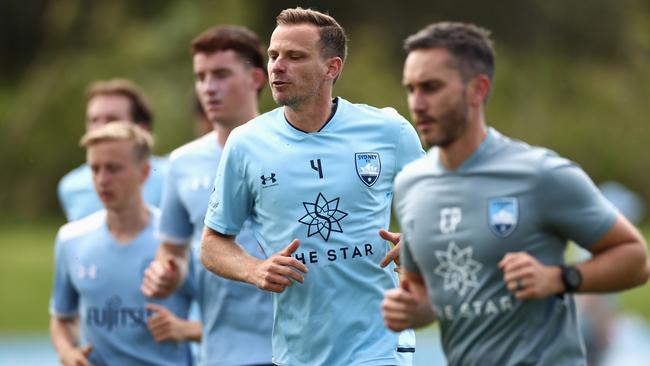 Alex Wilkinson (centre) trains hard in preparation for the A-League season. Picture: Cameron Spencer / Getty Images