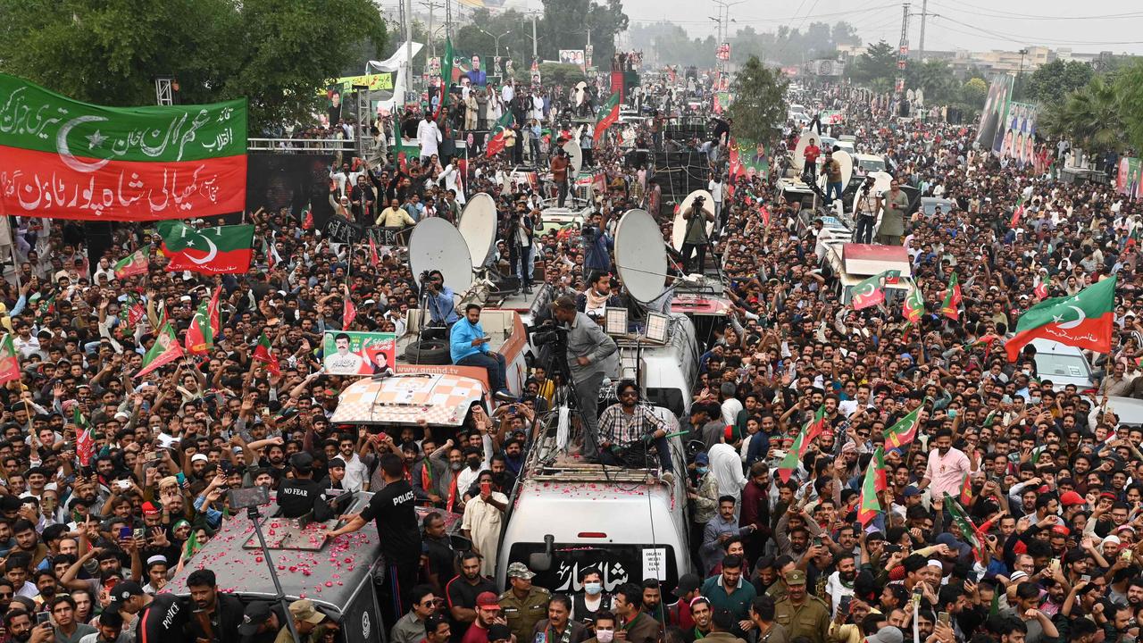 Supporters of Pakistan's former prime minister Imran Khan take part in an anti-government march towards capital Islamabad. Photo by Arif ALI / AFP