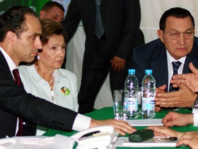 A file photo taken on September 07, 2005 shows Egyptian President Hosni Mubarak (R) monitoring election results with his wife, Suzanne, and younest son, Gamal (L). Picture: AFP