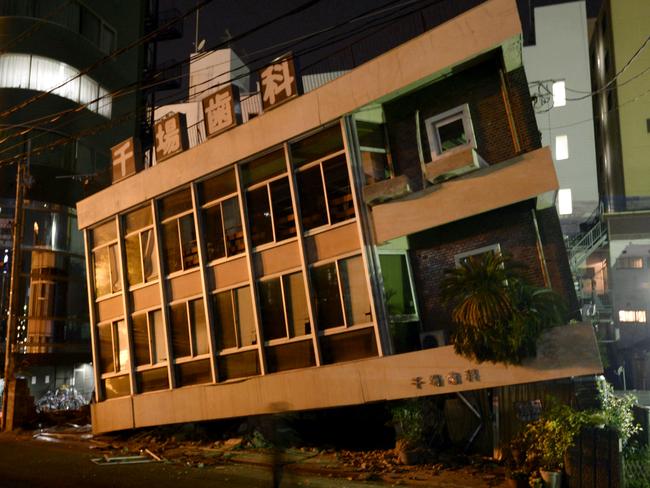 A severely damaged dentist office leans to one side following the 7.0 magnitude earthquake in Kumamoto, southern Japan. Picture: Koji Harada/Kyodo News.