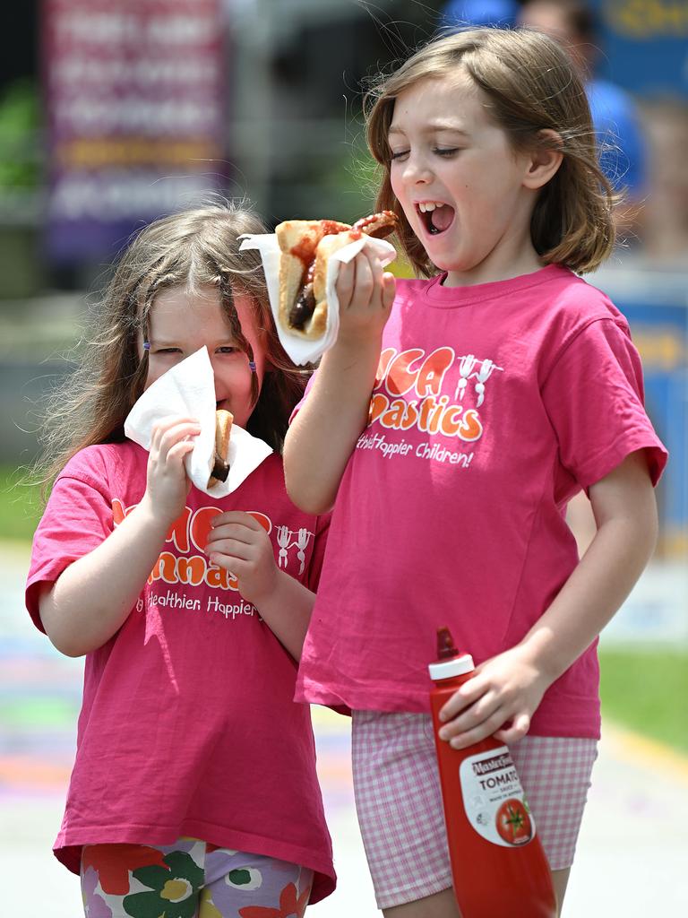 They may not be able to vote, but sisters Ailish, 4, and Orlaith Gordon, 8, were happy to take part in one election day tradition. Picture: Lyndon Mechielsen