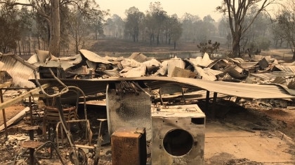 Jamie Zaia and Anita Reeves lost their home in the bushfires (pictured) They have now been caught up in a bushfire business grants scam, where a Belmont South man allegedly used their property to claim $50,000. Supplied.