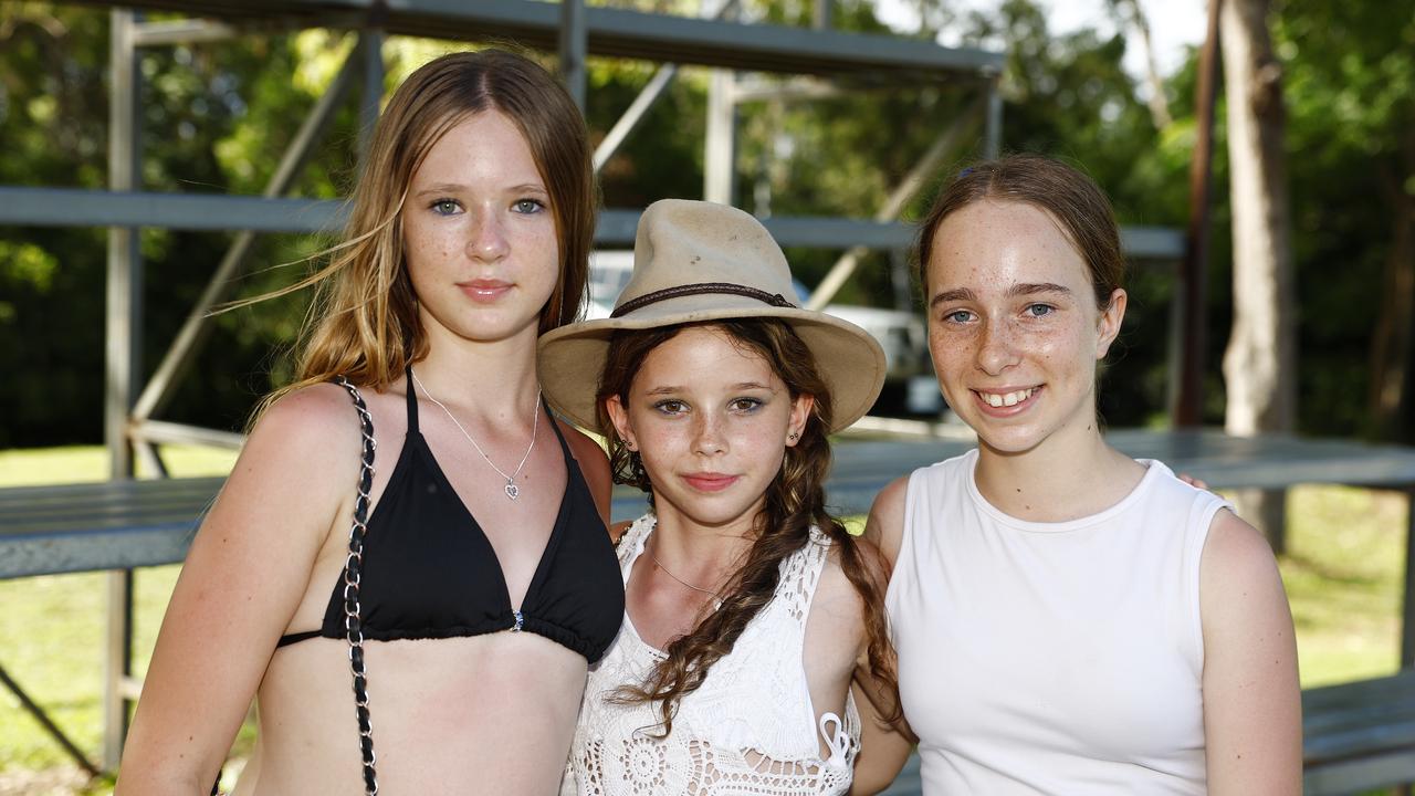 Mila Ritchie, 11, Wildey Edwards, 12, and Caitlyn Simpson, 12, at the Little Day Out family day, held at the Holloways Beach Sports Oval and raising funds for the Holloways Hub. Picture: Brendan Radke