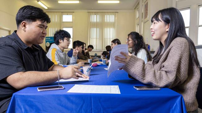 Jaesen Pich at a speed-friending event in Adelaide, talking with Bona Kwon, 20. Picture: Kelly Barnes