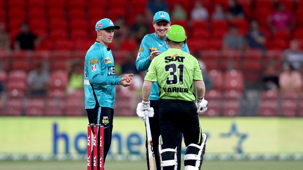 Labuschagne and Matt Renshaw talk to David Warner in the middle. Picture: Jeremy Ng/Getty Images