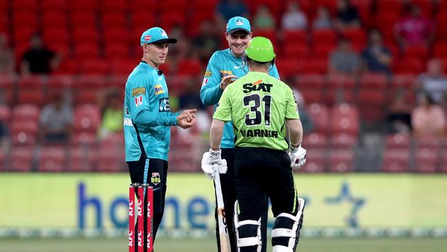 Labuschagne and Matt Renshaw talk to David Warner in the middle. Picture: Jeremy Ng/Getty Images