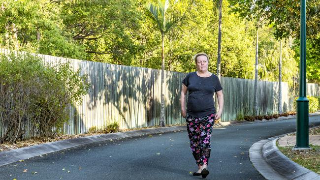 Neighbouring resident Jennifer Matton walks by the trees to be cleared as part of the bakery site redevelopment. Picture: AAP/Richard Walker