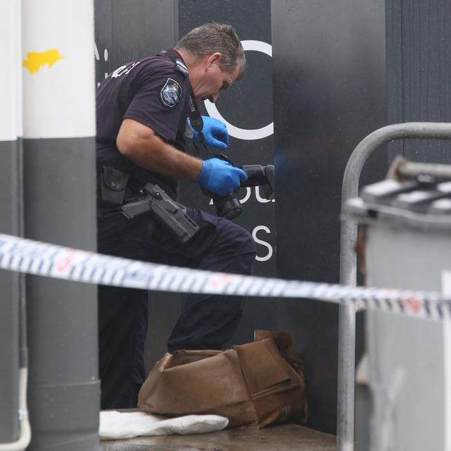 A police officer next to the charity bin. Picture Glenn Hampson