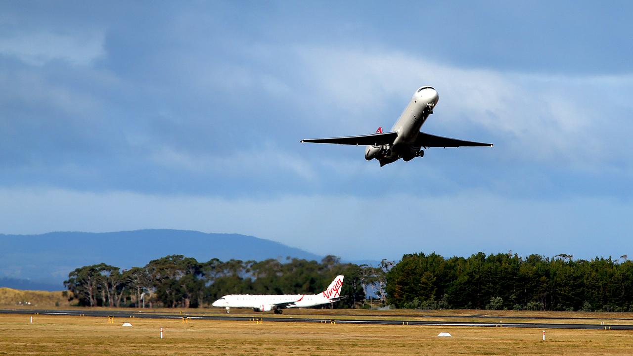 a Qantas plane takes off from Hobart Airport