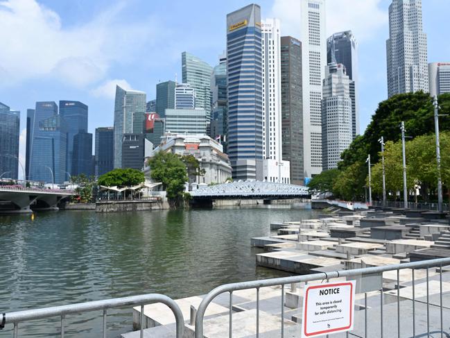 A section of a public area is temporarily closed as preventive measure against Covid-19 coronavirus at the the financial business district in Singapore on June 25, 2021. (Photo by Roslan RAHMAN / AFP)