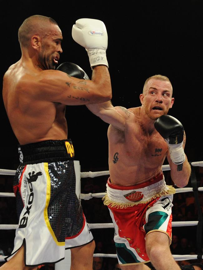 Australian boxers Anthony Mundine (left) and Garth Wood fight during are-match in Brisbane in 2011. Picture: Dave Hunt