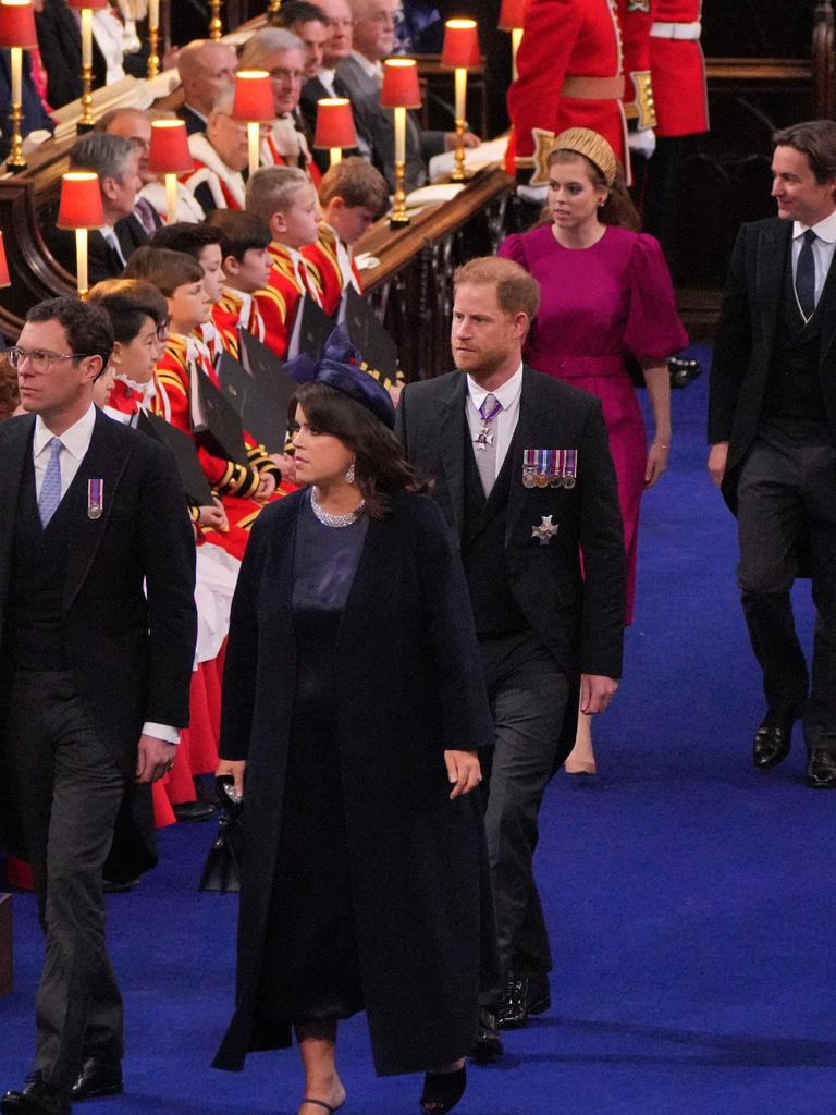 Prince Harry walked inside the abbey alone, flanked by cousins Princess Eugenie and Princess Beatrice and their partners. Picture: Aaron Chown/Pool/AFP