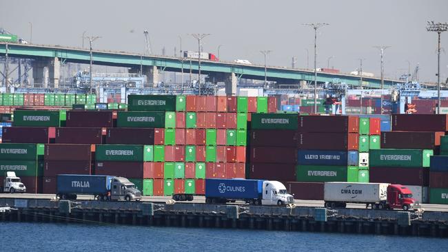 Trucks wait in line in front of containers at the Port of Los Angeles, in San Pedro, California, on Wednesday. Picture: AFP