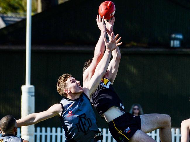 Jarman Sigal takes a mark over Port District’s Sean Davidson. Picture: Brenton Edwards