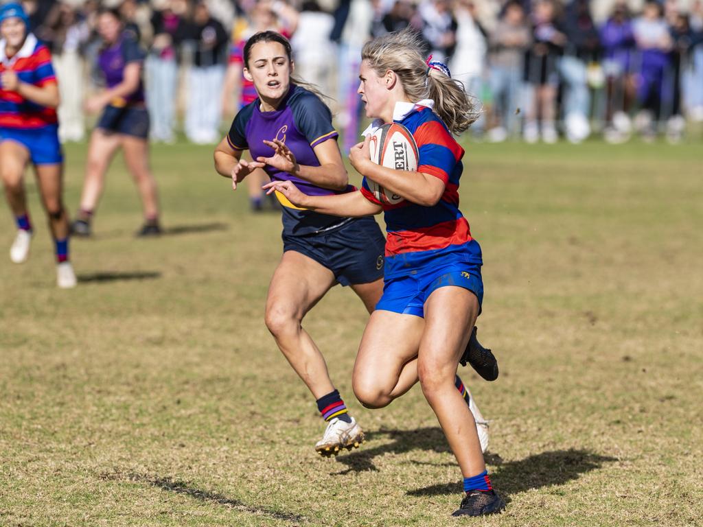 Jess Fitzgibbons on the way to a Downlands try in the final game against Glennie in rugby sevens Selena Worsley Shield on Grammar Downlands Day at Downlands College, Saturday, August 6, 2022. Picture: Kevin Farmer