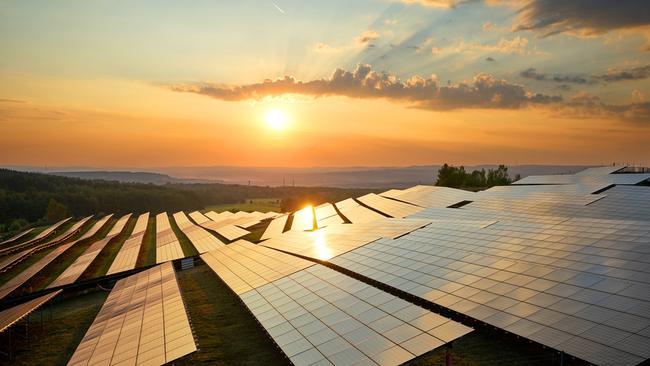 Photovoltaic panels of solar power station in the landscape at sunset. View from above. solar panel generic Townsville