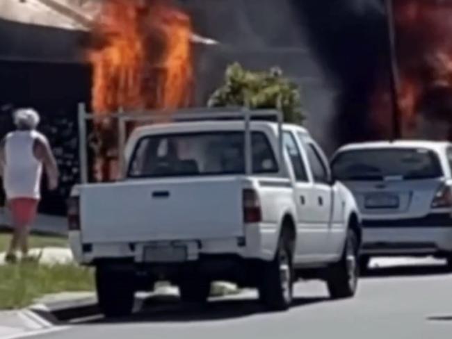 Screen grab of caravan on fire.