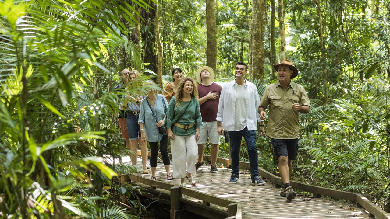 A guide leading a tour group on a rainforest walk on the Jindalba boardwalk, in the Daintree National Park. The boardwalk remains closed with no timeline on when it will reopen. Picture: Tourism and Events Queensland.