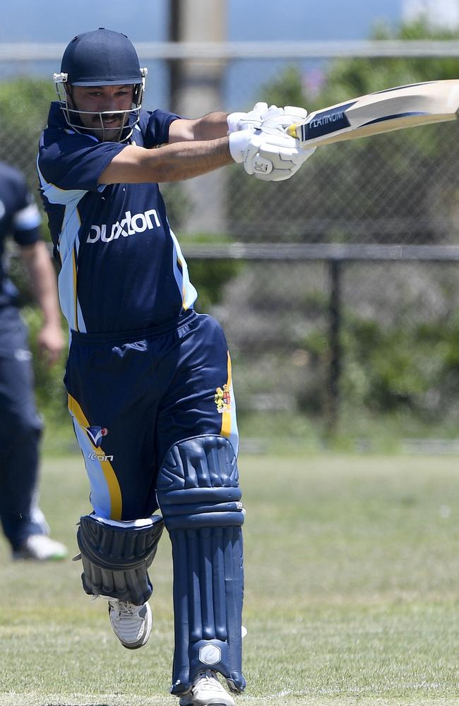 Ricky Damiano hits down the ground against Hoppers Crossing.