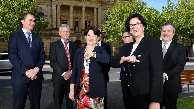 Justice Trish Kelly bumps elbows with Vicki Chapman alongside the new team of the Court of Appeal in 2020. Picture Mark Brake