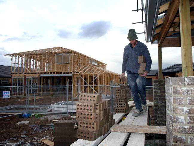 Travis Williams is a brick layer working on a housing estate at Point Cook Melbourne. Brick delivery fuel charge will add $2,000 to the cost of the average new home.