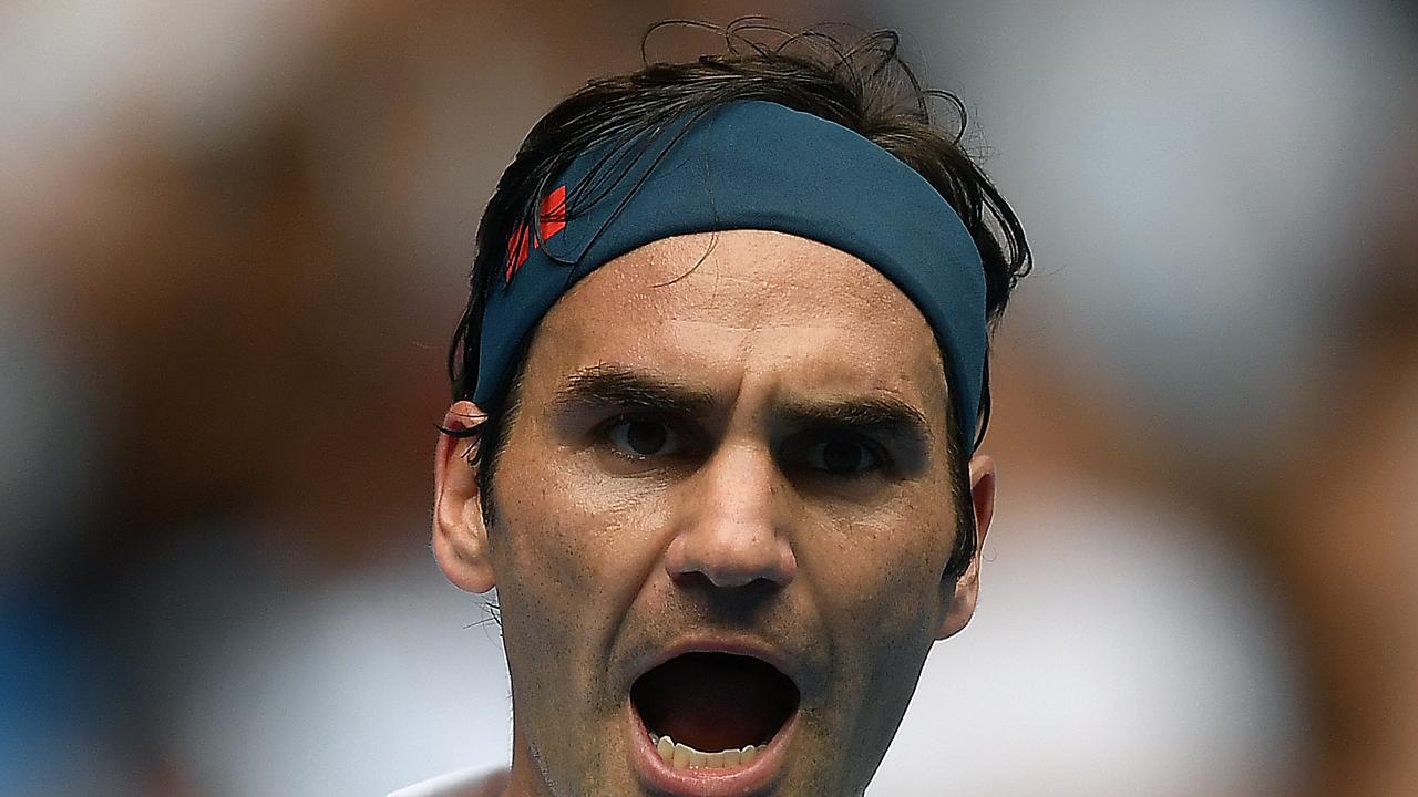 Roger Federer of Switzerland reacts during the match against Daniel Evans.