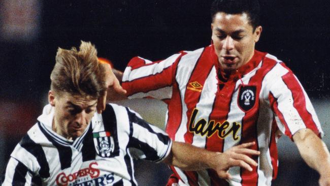 Former Adelaide City striker Damian Mori shields the ball from Sheffield United defender Brian Gale in 1994. 