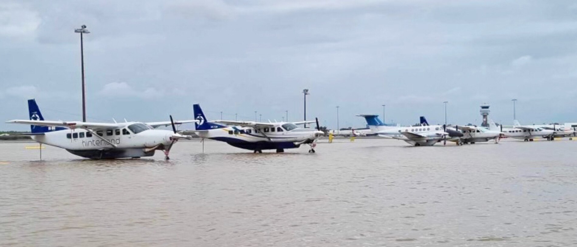 A close up shows aircraft marooned in the deluge. Picture: Hinterland Aviation