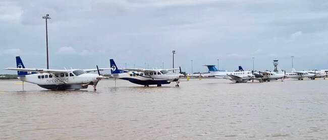 A close up shows aircraft marooned in the deluge. Picture: Hinterland Aviation