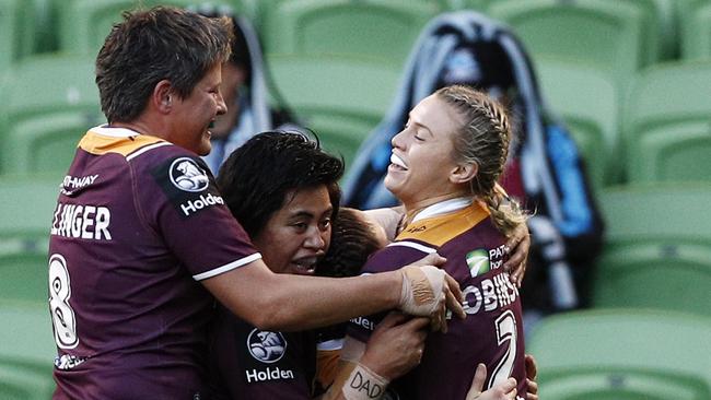 Julia Robinson (right) celebrates a try with her Broncos teammates at AAMI Park. Picture: AAP