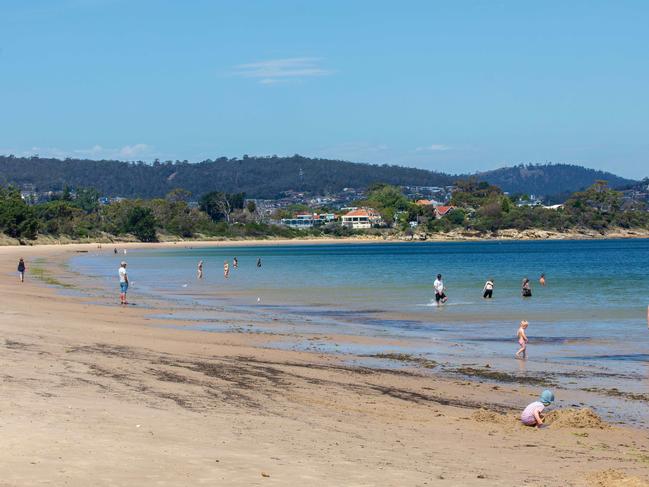 Beachgoers at Bellerive Beach on the hottest dat of summer so far.Picture: Linda Higginson