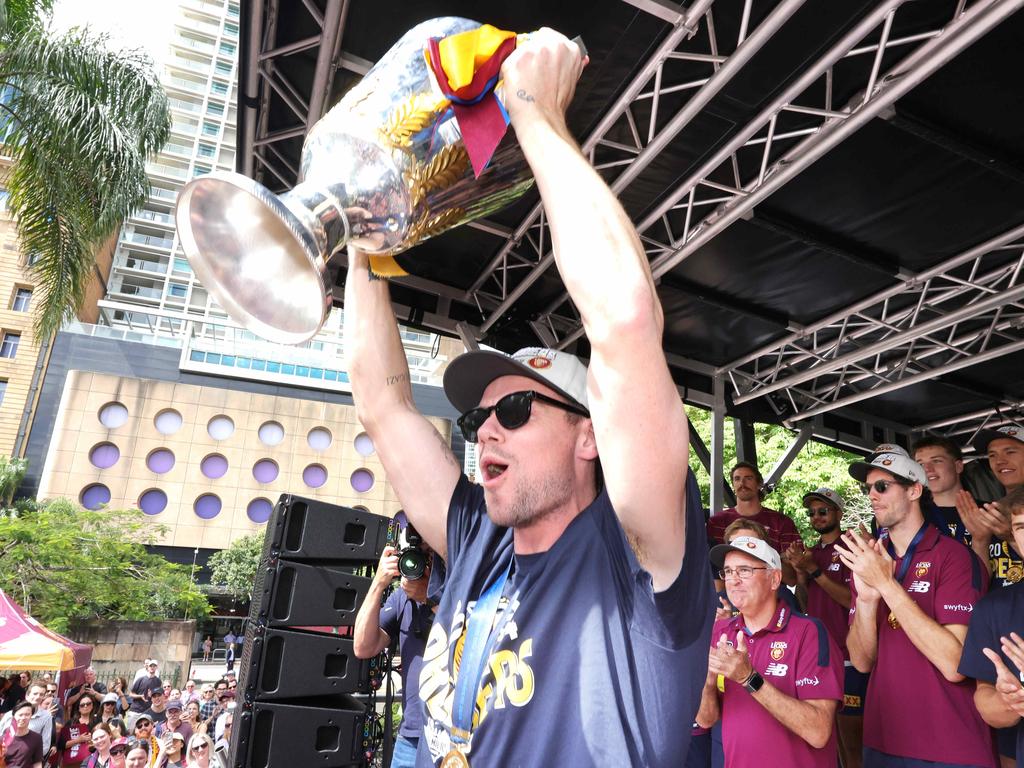 Lachie Neale shows off the premiership cup to Brisbane fans. Picture: Steve Pohlner