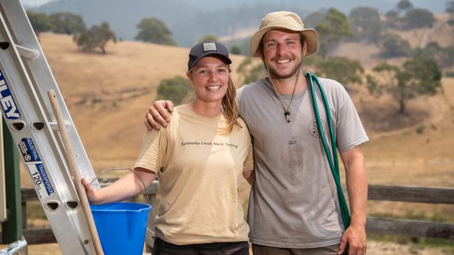 Laura Appleby, 26 and boyfriend Chris Cahill, 28 prepare for Friday’s worsening conditions. Picture: Jason Edwards