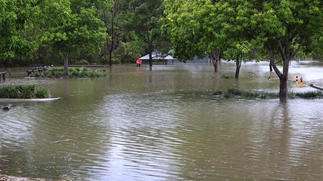 A storm over the Gold Coast has dropped rain causing flooding at Woodlands Park, Mudgeeraba. Pics Adam Head