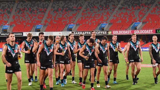 Port Adelaide players after the Power’s Round 1 victory. They now have to remain away from the club and do training by themselves (AAP Image/Darren England)