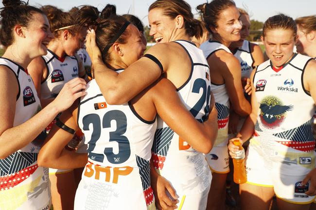 Crows Justine Mules (centre from left) and Chelsea Randall of the Crows (centre from right) celebrate beating Melbourne. 