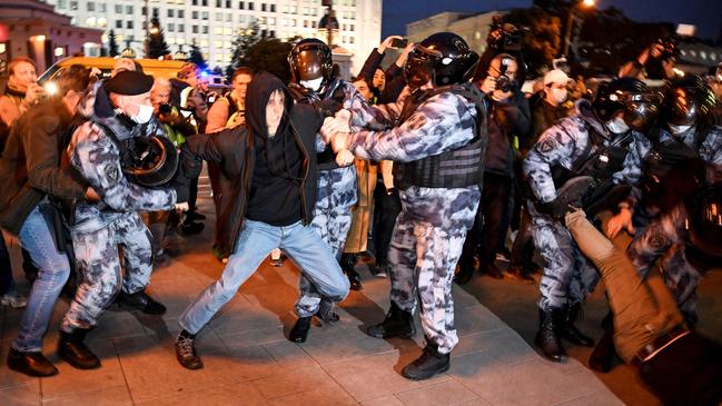 Riot police grapple with protesters in Moscow on Wednesday. Picture: AFP