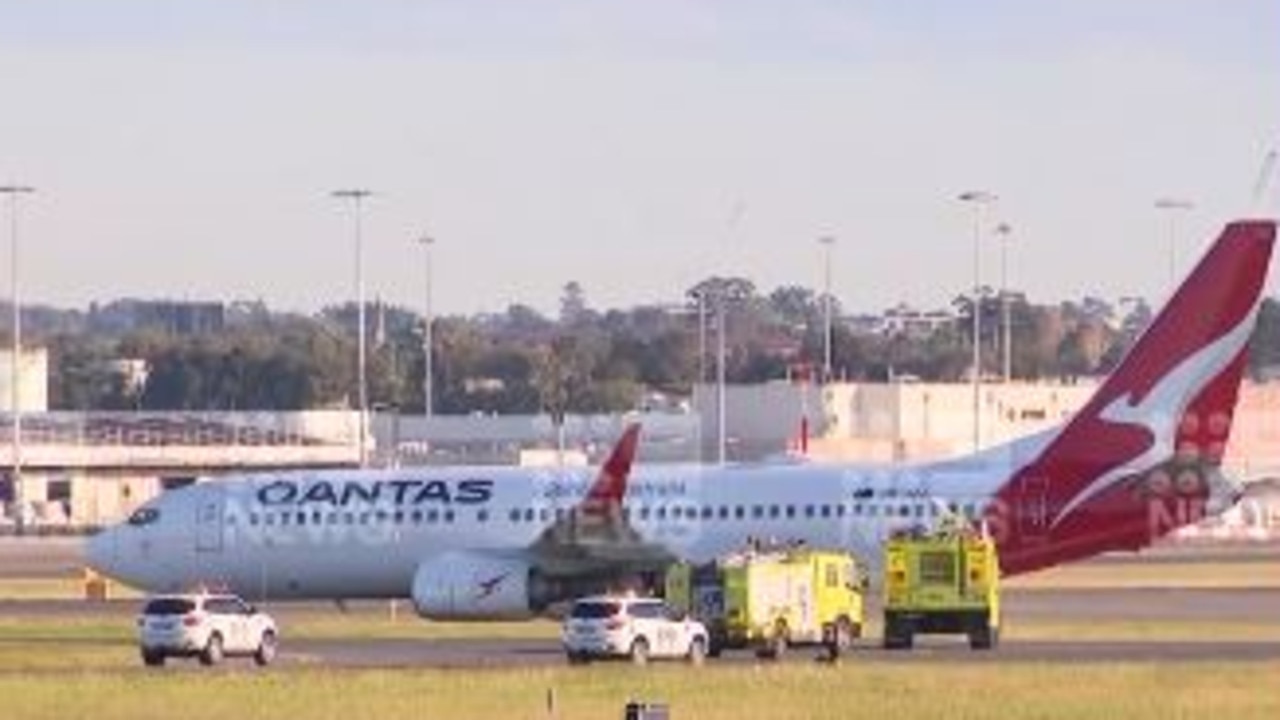 Passengers were removed from a Qantas plane after someone reported seeing smoke coming from an engine. Picture: 9 News