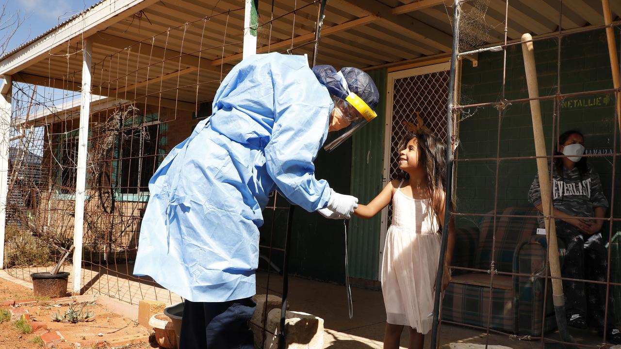 CareFlight Nurse/Paramedic Melissa Price visiting Lakiah 6yrs and her mother Nicola, Melissa, is checking on families in the small town of Wilcannia that are in isolation due to testing positive to Covid-19. Picture by Chris Pavlich for The Australian.