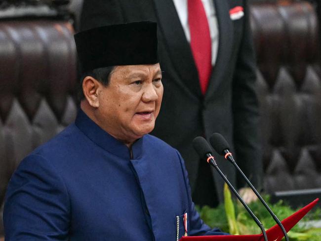 Indonesia's new President Prabowo Subianto takes the oath during the presidential inauguration ceremony at the Parliament building in Jakarta on October 20, 2024. Former general Prabowo Subianto was sworn in October 20 as president of Indonesia, seeking a more prominent position on the global stage for the world's fourth most populous nation. (Photo by BAY ISMOYO / AFP)