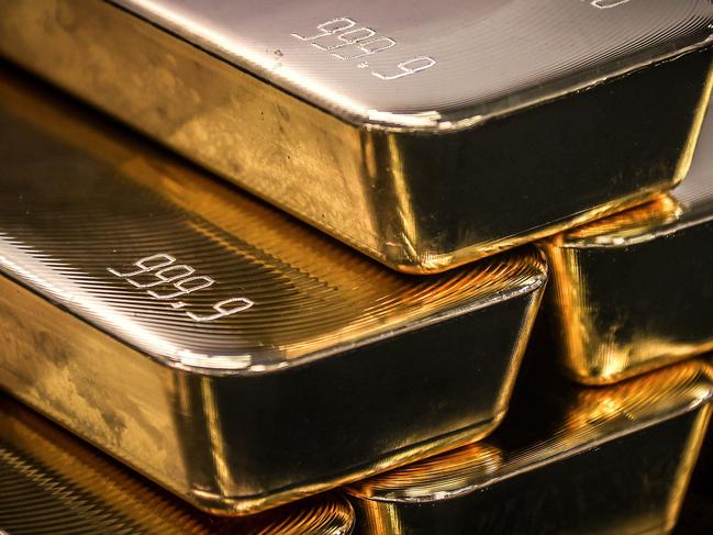 TOPSHOT - Gold bullion bars are pictured after being inspected and polished at the ABC Refinery in Sydney on August 5, 2020. - Gold prices hit 2,000 USD an ounce on markets for the first time on August 4, the latest surge in a commodity seen as a refuge amid economic uncertainty. (Photo by DAVID GRAY / AFP)