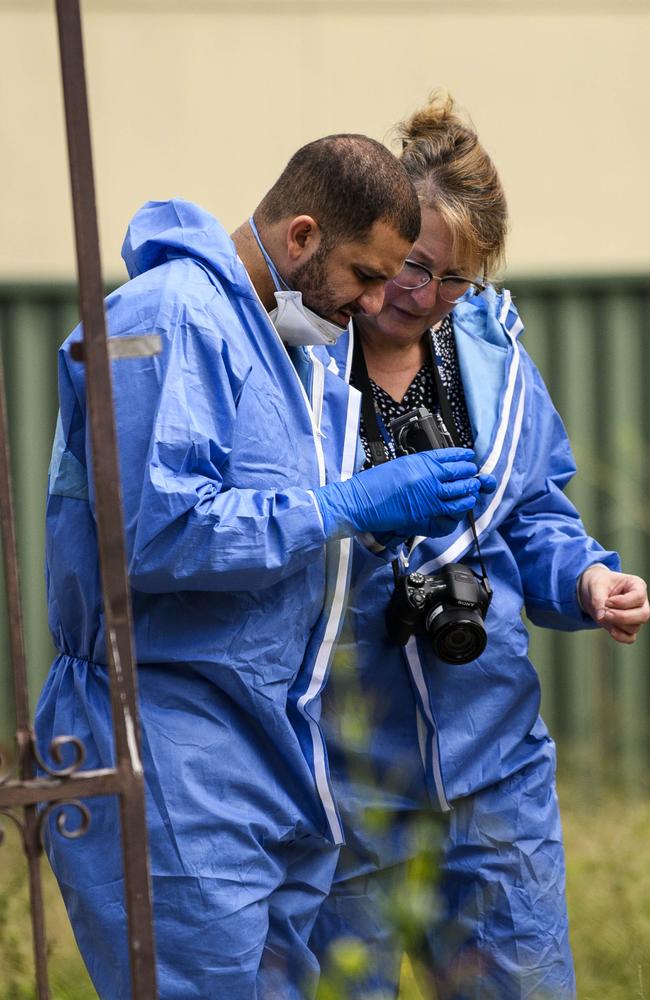 Forensics police were also filming and photographing evidence. Picture: Darren Leigh Roberts